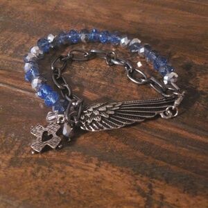 Silver tone wing bracelet with blue & clear beads
